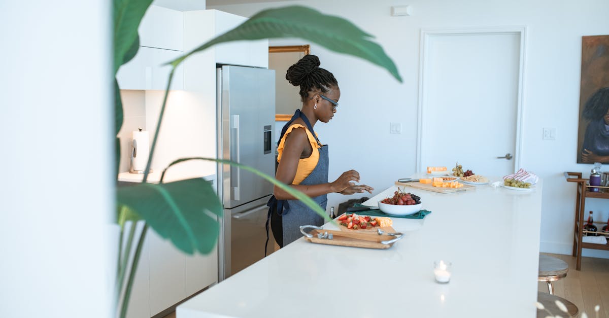 A woman preparing homemade dishes on a kitchen counter, creating a vibrant and modern domestic scene.