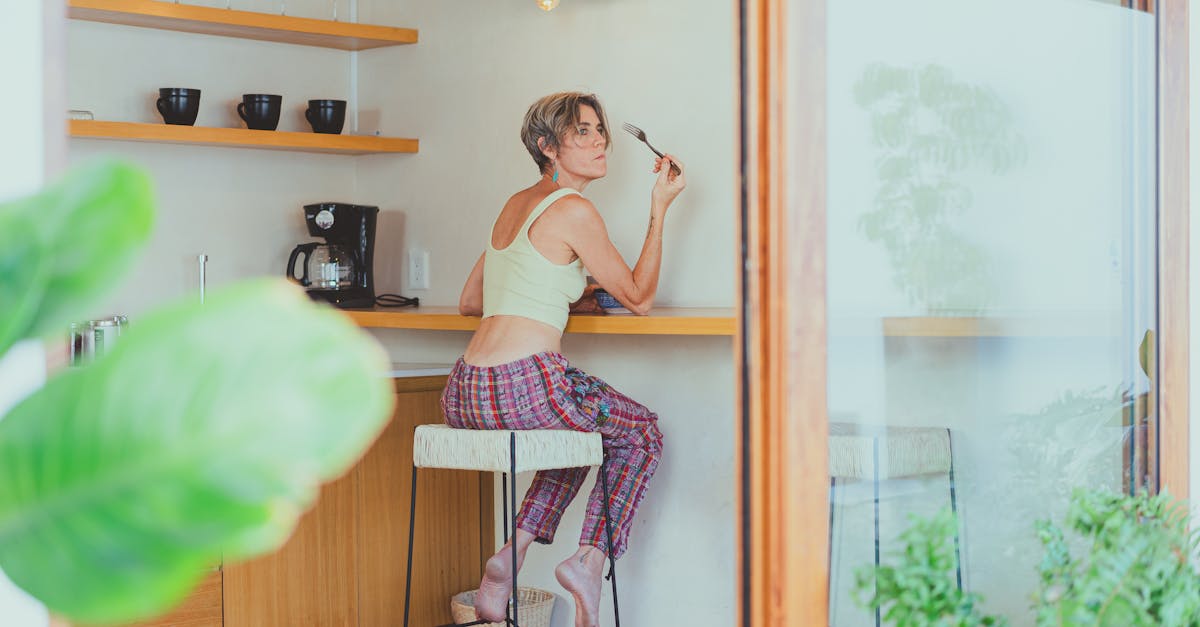 A senior woman enjoying a healthy breakfast indoors, promoting a positive aging lifestyle.